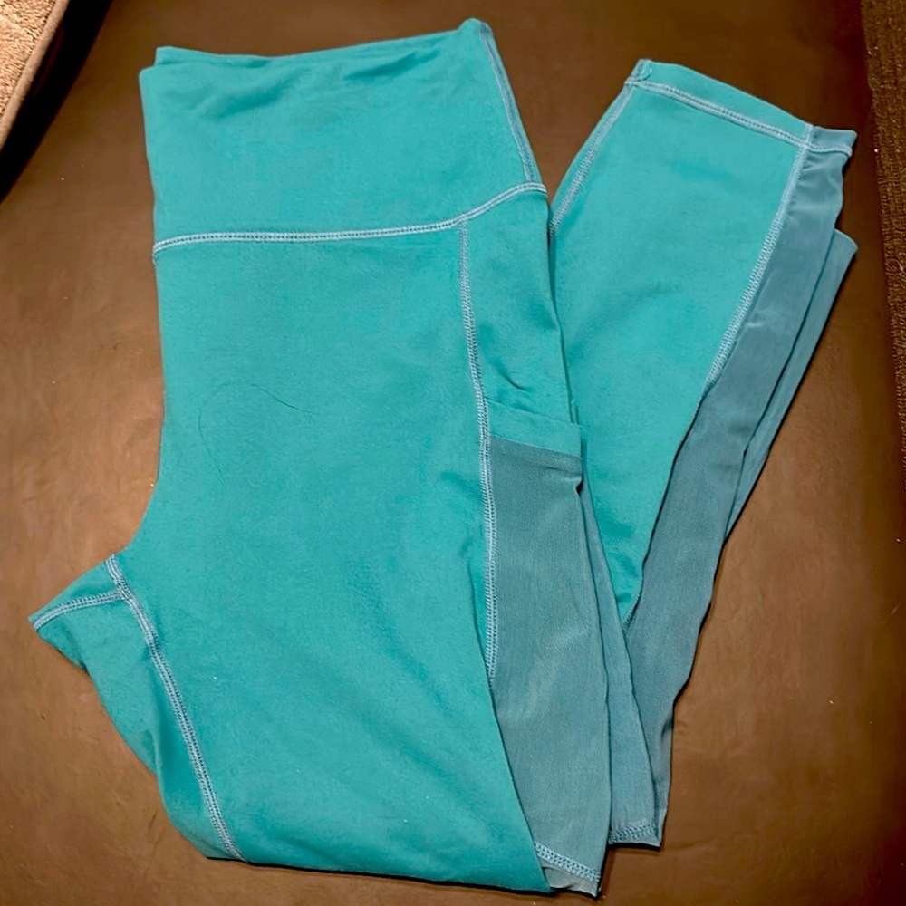 Fabletics On-The-Go PowerHold High-Waisted Capri teal cascade